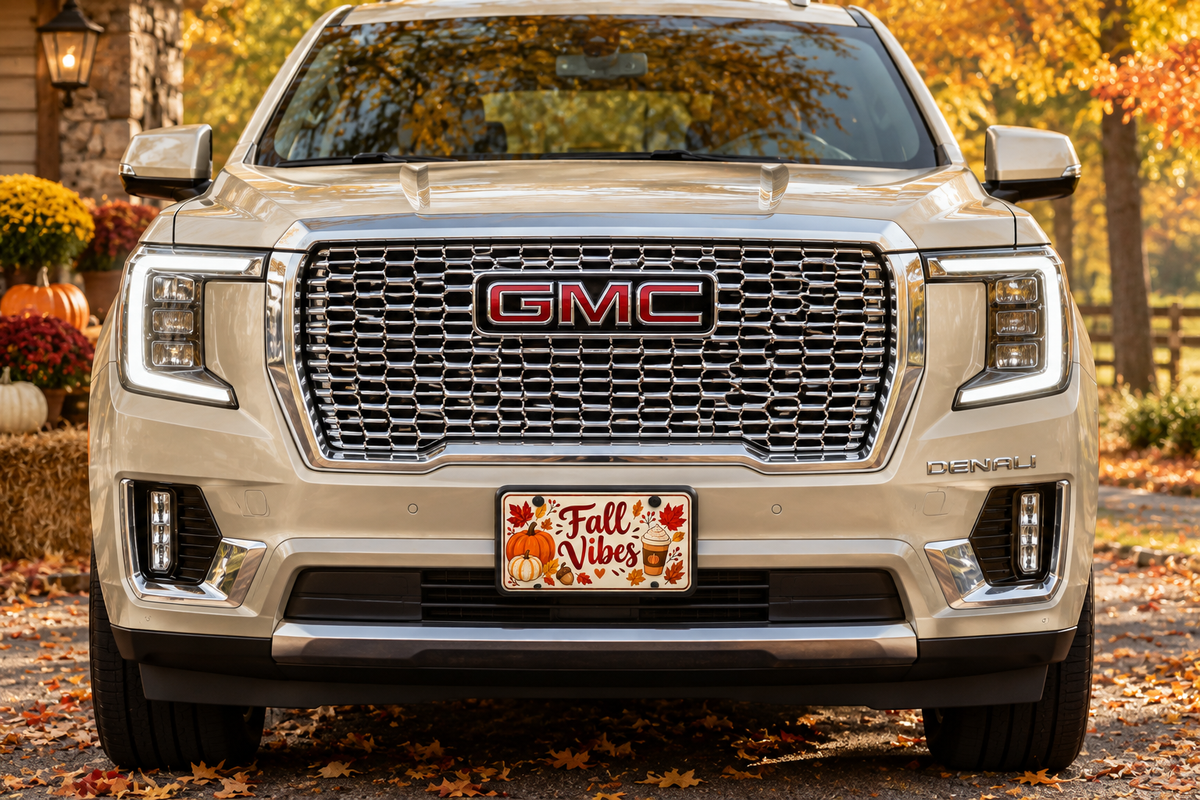 Fall license plate on the front of a beige GMC Yukon Denali